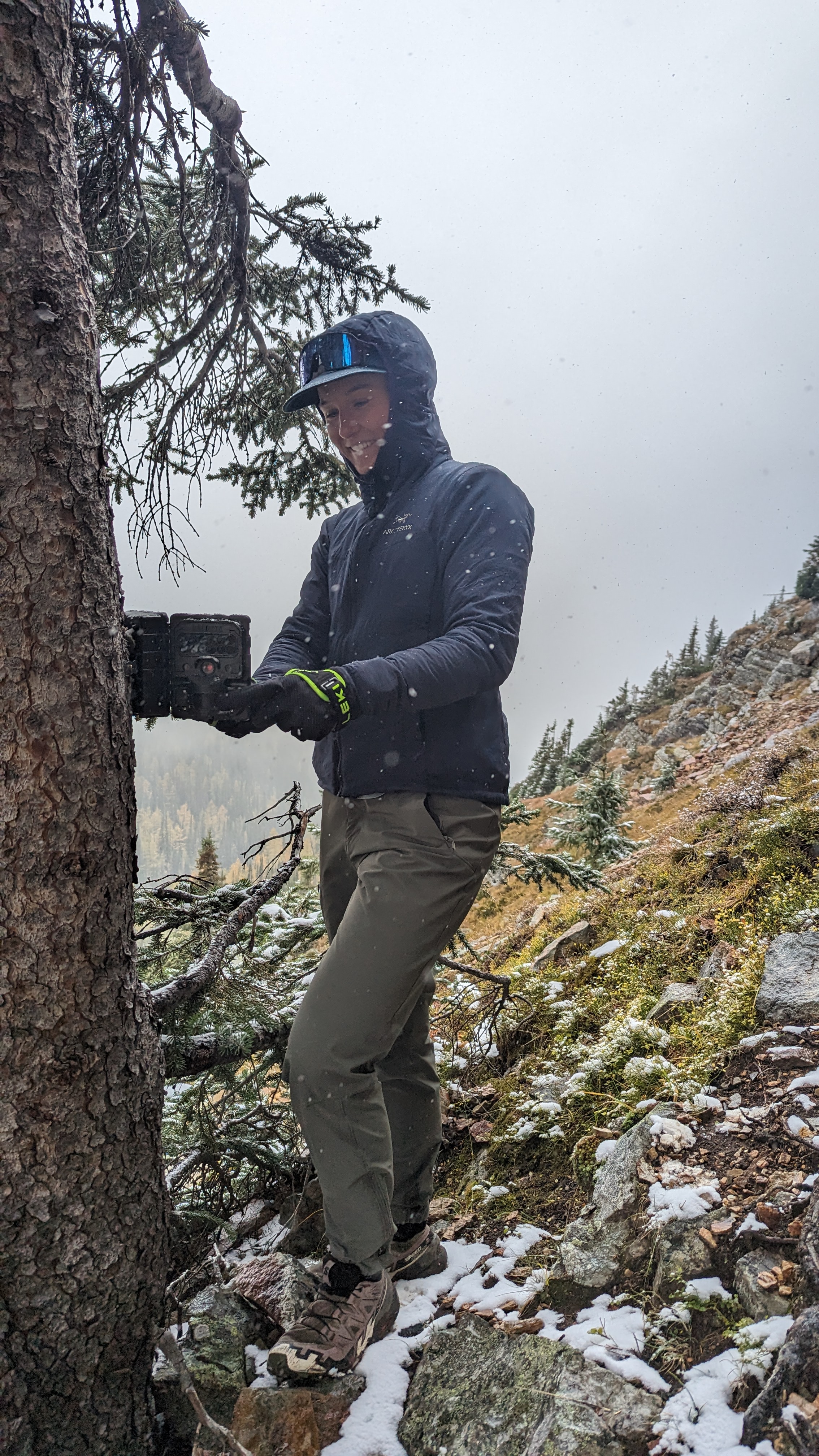 Checking a camera trap in Yoho National Park for my MSc